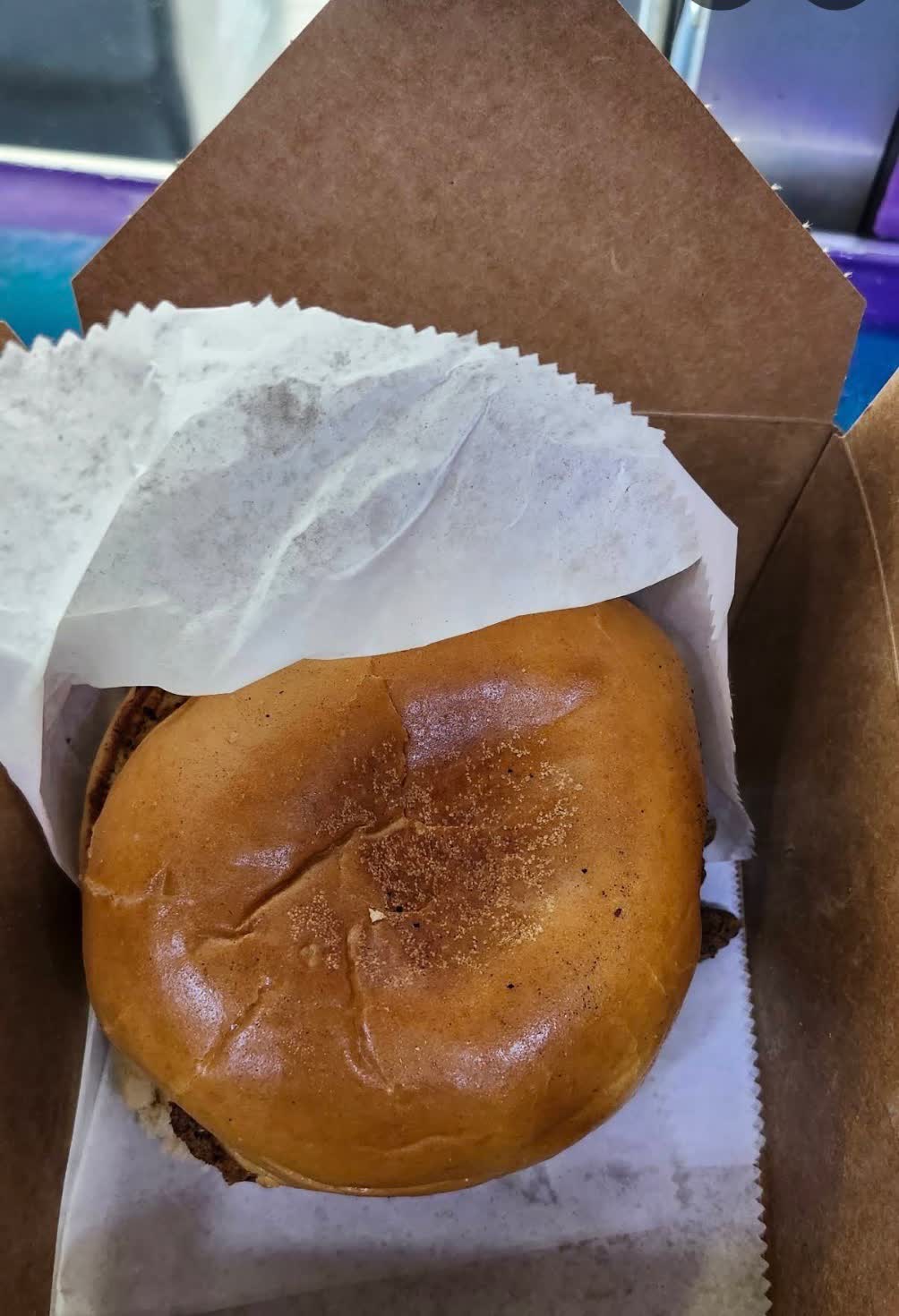 Crispy chicken sandwich in a takeout box