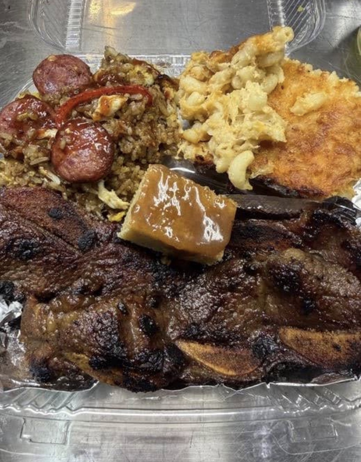 BBQ short ribs with jambalaya fried rice, baked mac and cheese and cornbread